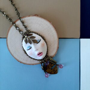 wearable art face necklace by french ostrich