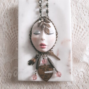 wearable art face necklace by french ostrich