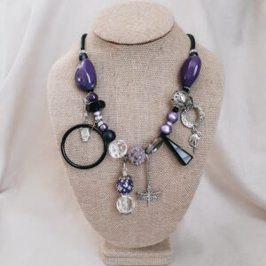 purple and black statement necklace by french ostrich