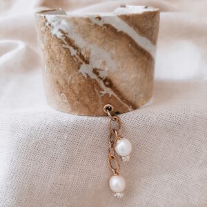 gold and white cuff bracelet by french ostrich