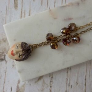 wearable art face necklace by french ostrich