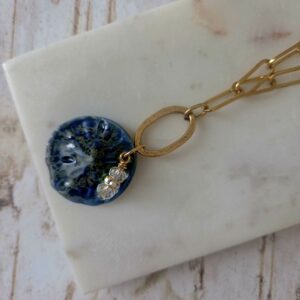 sand dollar necklace on paperclip chain by french ostrich